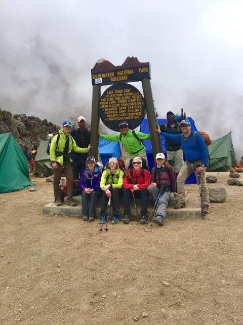 Discerning trekkers ascending the towering volcanic structure of Lava Tower for high-altitude acclimatization