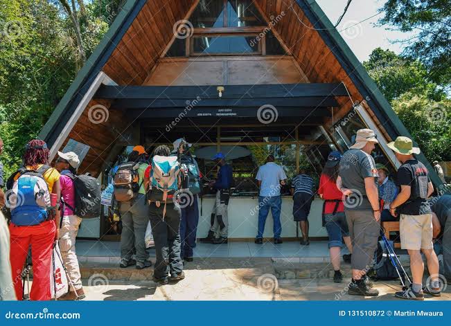 Successful trekkers checking out at Marangu Gate after completing their Mount Kilimanjaro climbing tour