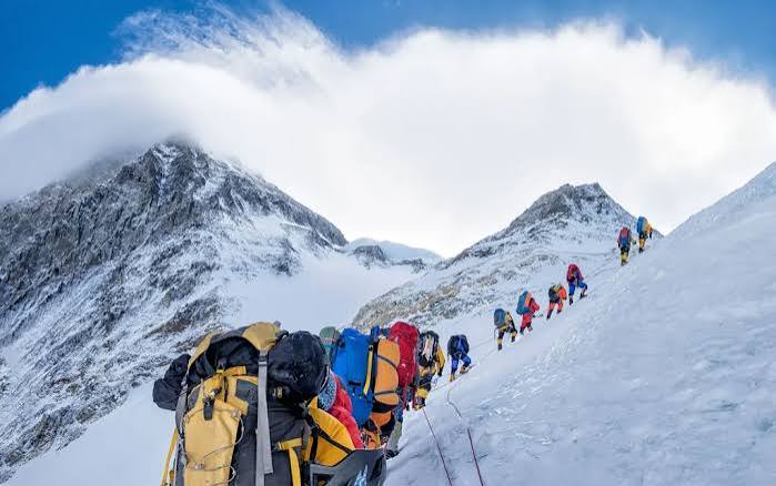 Hikers reaching Uhuru Peak on Mount Kilimanjaro during a luxury 6-day trek