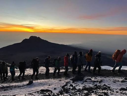 Breathtaking panoramic level view of the snow-capped African summit from the remote Northern Circuit path