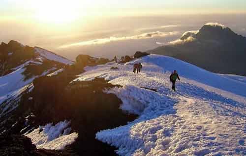 Hikers crossing the vast alpine moorland near Simba Camp on Kilimanjaro